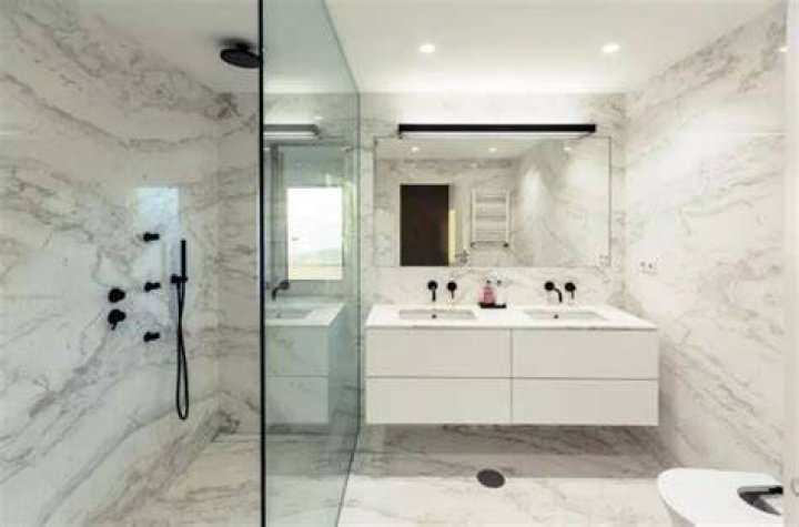 Is marble cheaper than tile?